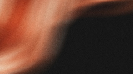 Obraz premium Abstract soft flowing orange fabric wave texture with deep black shadow contrast creating a smooth elegant minimalist background for luxury creative design projects