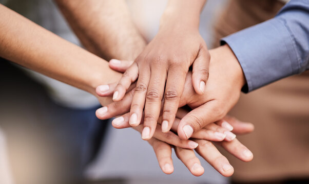 Business, people or handstack with motivation, team victory or support with group unity. Success, staff pile and employees with hands together, collaboration and synergy with milestone reach.