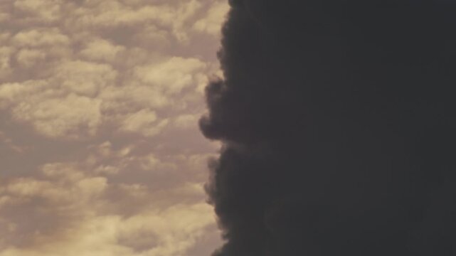 Vertical contrast of stormfront and bright cumulus sky texture