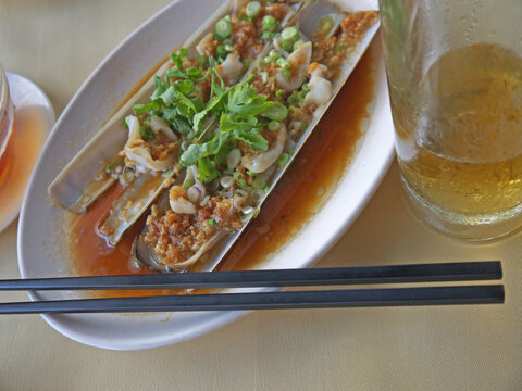 Singapore Bamboo clams cooked in shells with garlic oil and beer