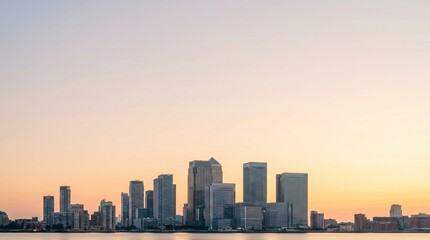 Obraz premium Modern City Skyline at Sunrise A Peaceful Dawn Over the Urban Landscape