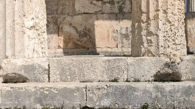 The Temple of Aphaia on Aegina island, Greece, a well preserved temple featuring impressive Doric columns and intricate sculptural details from around 500 BCE, overlooking the the Saronic Gulf