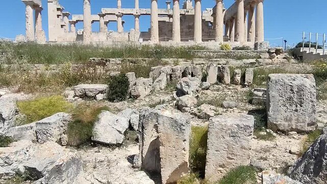 The Temple of Aphaia on Aegina island, Greece, a well preserved temple featuring impressive Doric columns and intricate sculptural details from around 500 BCE, overlooking the the Saronic Gulf