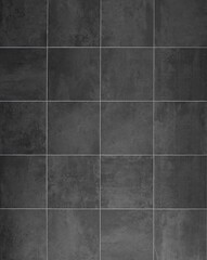 Fototapeta premium Black and gray anthracite stoneware square tiles with concrete effect. Background and texture. Full frame.