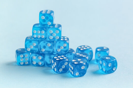 Many blue game dices on color background