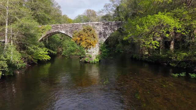 Historic Arch Bridge Of Ponte Medieval de San Alberte In Guitiriz, Galicia, Spain. Wide Shot