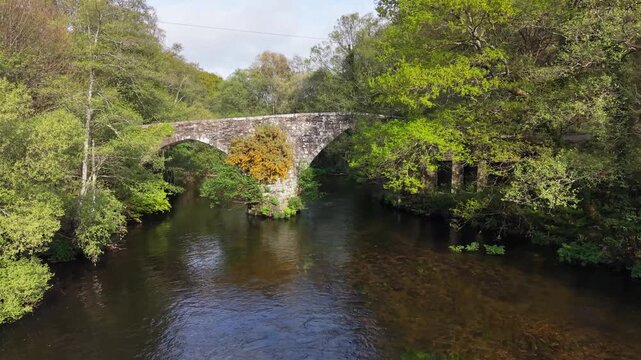 Ponte de San Alberte - Historic Stone Arch Bridge In Guitiriz, Spain. Aerial Pullback Shot