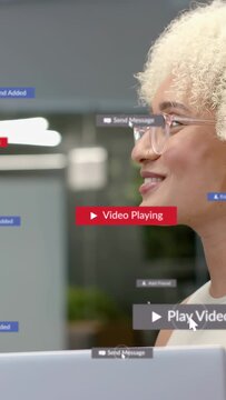 Vertical video: Mouse hovering playing media, business pros seeing laptop, tags popping, working