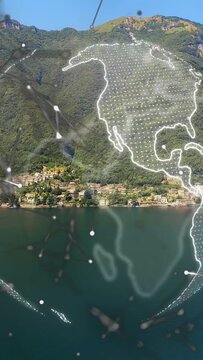 Vertical video: Haze rising, globe rotating, nodes linking continents, showing links over lake
