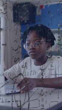 Vertical video: Boy typing on PC learning math as TA hand reaching causing glance graphs overlaying