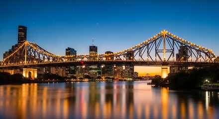 Fototapeta premium Illuminated bridge spans river reflecting city lights under twilight sky