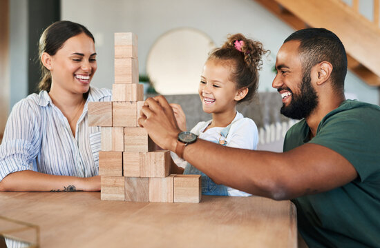 Family, parents or girl with blocks in living room, coordination development or support for bonding. Play together, happy people or child stack toys for fine motor skills, balance game or fun in home