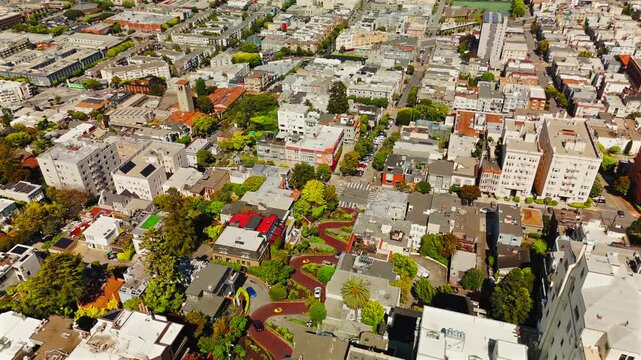 Drone view above Lombard Street residential blocks and city streets
