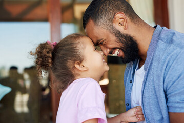 Fototapeta premium Dad, daughter and forehead touch in home with family together for bonding, love or support. Laughing, moment and security with development, girl child and single parent man in apartment for growth