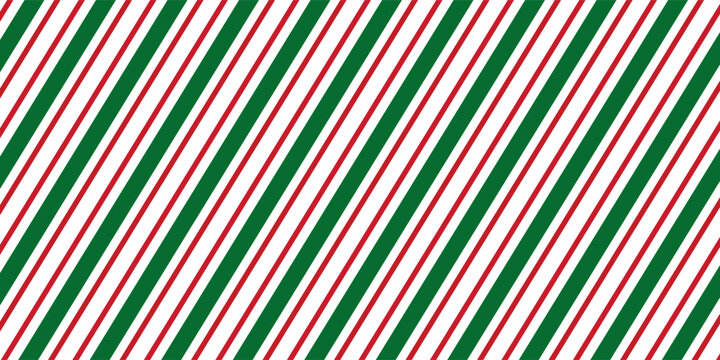 Seamless pattern of diagonal red and green stripes on white background. Classic candy cane style for Christmas, holiday decorations, and festive wrapping paper design.