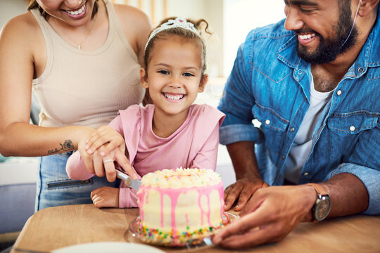 Birthday, cake and girl portrait with parents in home for celebration, cutting or milestone. Growth, party and smile of daughter, mom and dad in living room for bonding, dessert or happy family