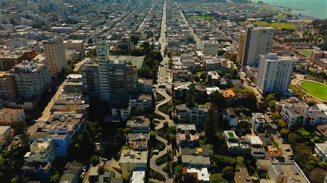 Slow aerial view of Lombard Street and dense San Francisco neighborhood
