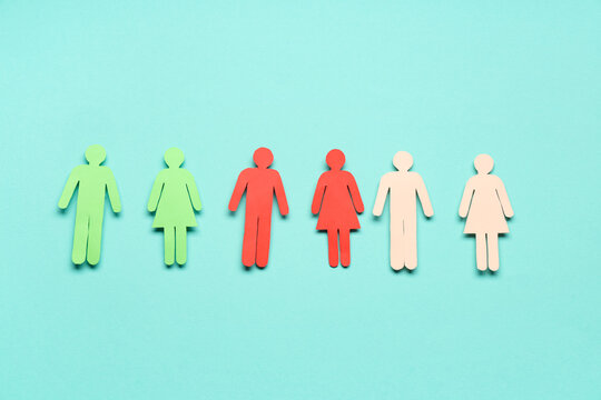 Paper human figures on blue background