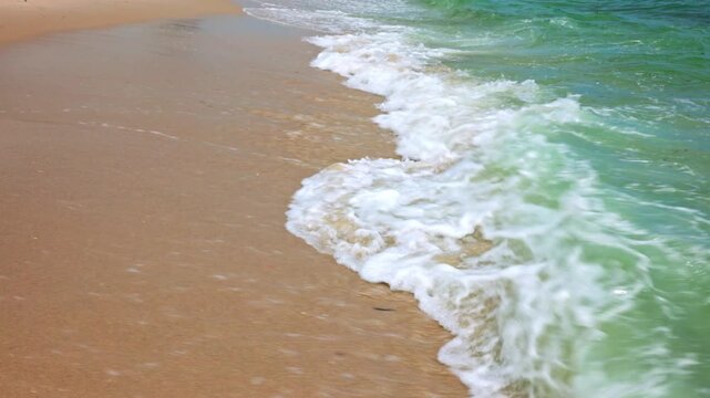 Beautiful view of turquoise Atlantic Ocean waves washing sandy tropical beach coastline. Miami Beach. USA. 