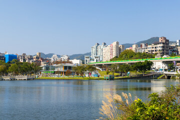 Fototapeta premium Long modern walkway along the blue lake shore