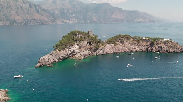 Drone over the historic lagoon with boats and yachts. Capo Vaticano in the Municipality of Ricadi in Calabria, Italy. Sunny summer day.