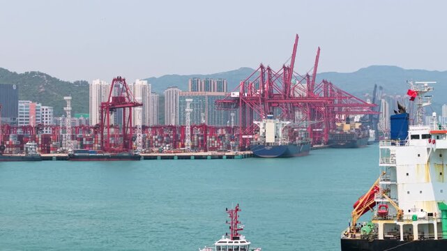 Aerial footage commercial logistics industry. The containers is loaded unloaded at Container Terminals Of Hong Kong
