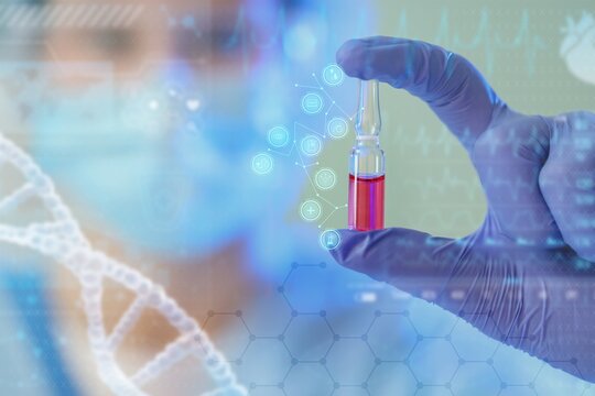 Scientist with ampule in laboratory, closeup. DNA research technology