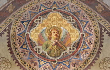 Obraz premium BERGAMO, ITALY - MARCH 18, 2026: The neo gothic freesco of angel in the church Oratorio dell Immacolata by unknown artis from beginn of 20. cent.