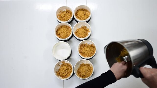 Pastry chef making a crumbly biscuit base for cheesecake