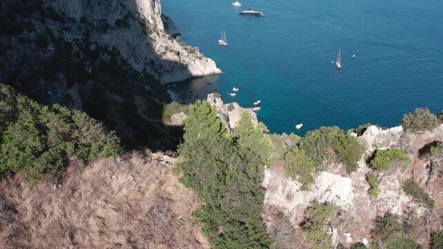 Drone over the historic lagoon with boats and yachts. Capo Vaticano in the Municipality of Ricadi in Calabria, Italy. Sunny summer day.