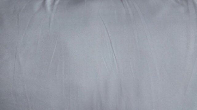 Soft and Smooth Light Gray Fabric Ideal for Bedding and Upholstery, Offering Comfort and Elegance in Home Interior Textiles