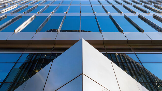 Modern Corporate Building Facade with Reflective Glass and Geometric Lines