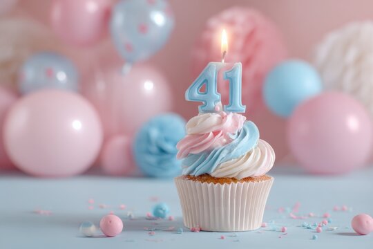 Elegant birthday cupcake with colorful swirls and lit candle for 41st celebration
