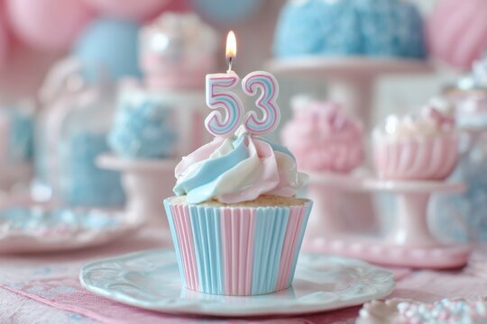 Colorful birthday cupcake with candle and number 53 for celebration