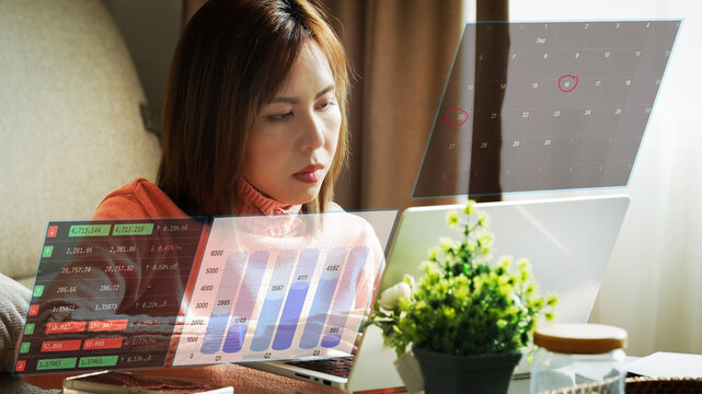 Serious businesswoman working under deadline pressure from home office with laptop financial charts and calendar schedule overlays