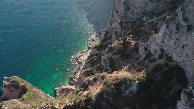 Drone on the rocks in the sea lagoon on a sunny day. Capo Vaticano in the Municipality of Ricadi in Calabria, Italy.
