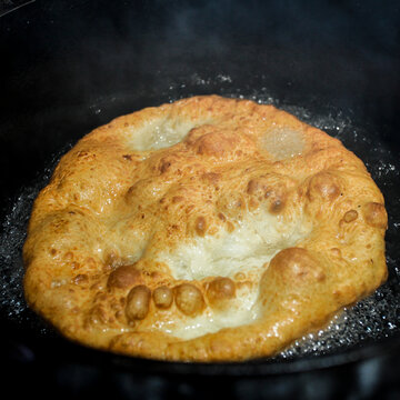 Traditional fry bread cooking in hot oil