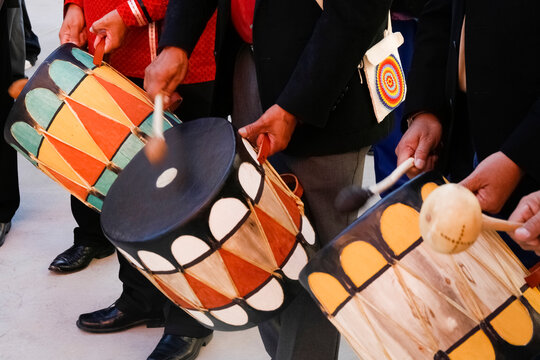 Pueblo drummers playing traditional hand drums in Santa Fe