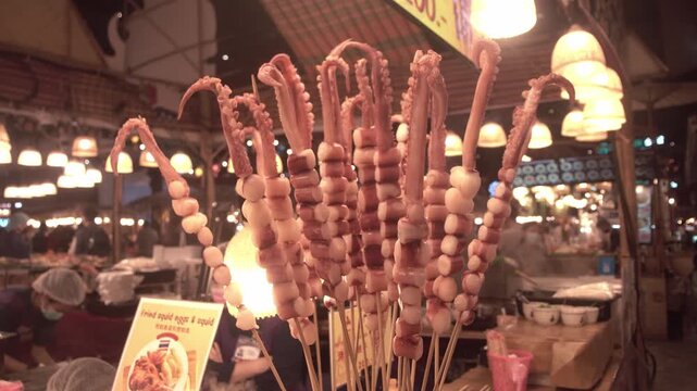 Fried giant octopus at a street food stall in Bangkok, Thailand.