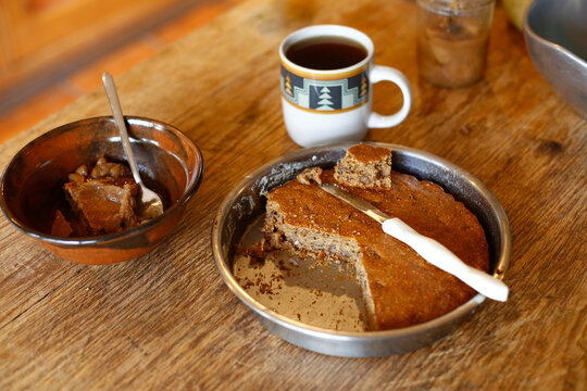 Homemade apple cake with coffee on rustic table