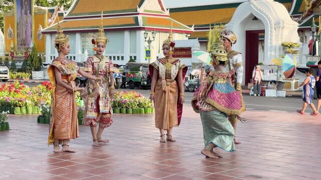 Traditional Thai Khon Dancers Perform in Front of Wat Suthat Temple