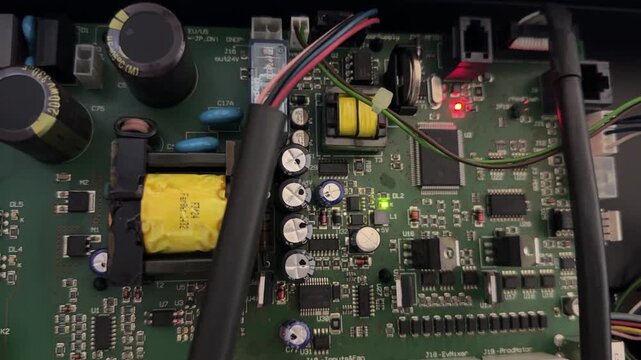 electronic control board inside coffee vending machine in close up, internal hardware and automation system detail