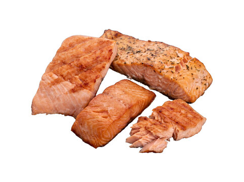 Group of perfectly cooked salmon portions, some seasoned and flaked, isolated on a transparent background.
