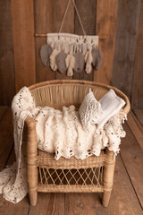 Boho style. Wicker chair. Backdrop for a newborn photo shoot. Beige tones. Natural style. © Наталія Павлова