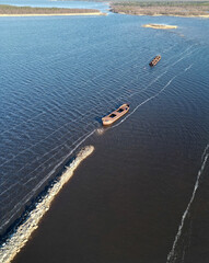 Fototapeta premium Pateniemenranta breakwater with rusty sunken prams in springtime, Oulu Finland