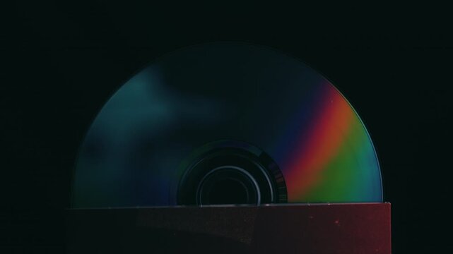Rainbow light shining off the surface of a CD disk