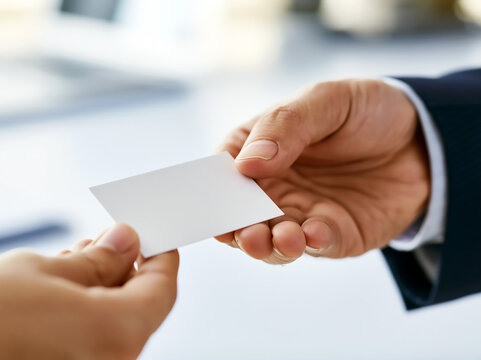 Japanese business card exchange ceremony, hands passing meishi in formal business meeting