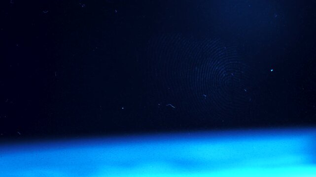 Macro of human fingerprint on a glass surface