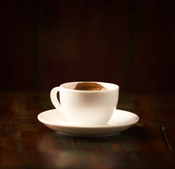 Fototapeta premium Cup of coffee on rustic wooden background. Soft focus. Copy space