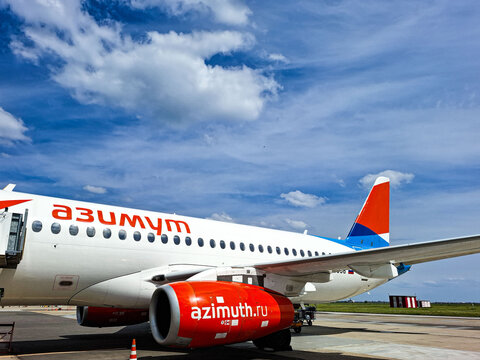 KRASNODAR, Russia - April 29, 2026.Azimuth Airlines Sukhoi Superjet on the tarmac at the airport under a blue sky with clouds